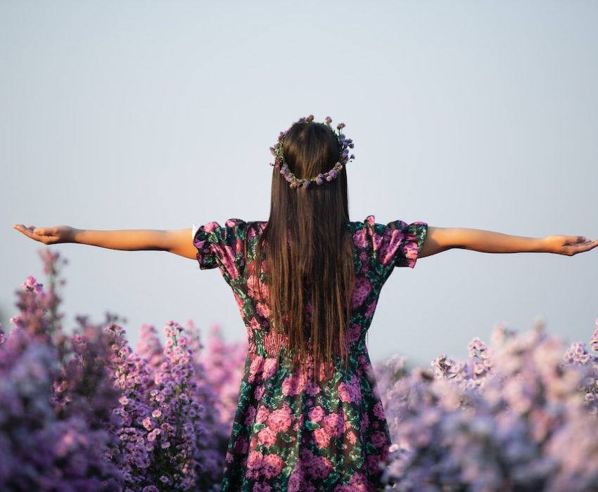 joyfull-woman-purple-dress-purple-margaret-flower_1150-20472